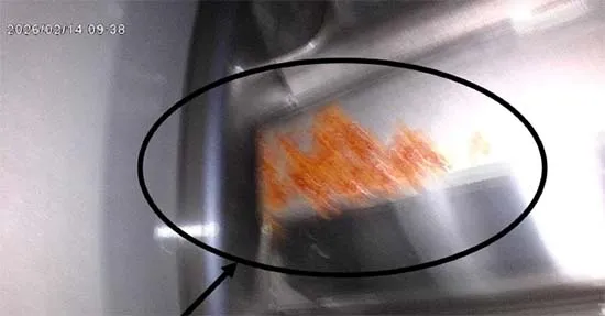 Figure 2. A large oxidation mark spread across the contact face of a gear tooth.