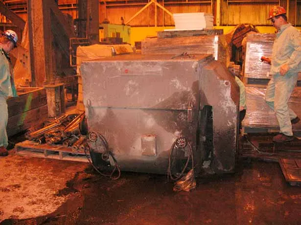 Combustion fan motor on floor.