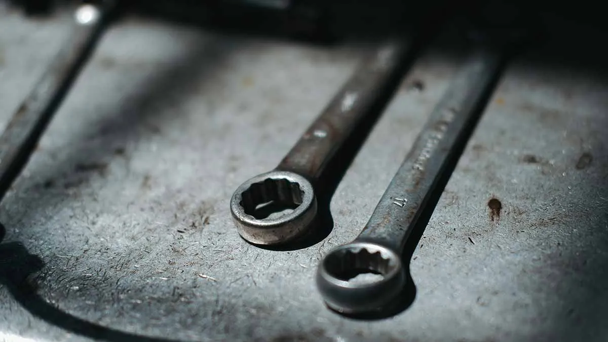 Two wrenches in dark area