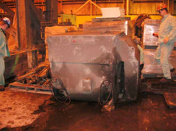 Combustion fan motor on floor.