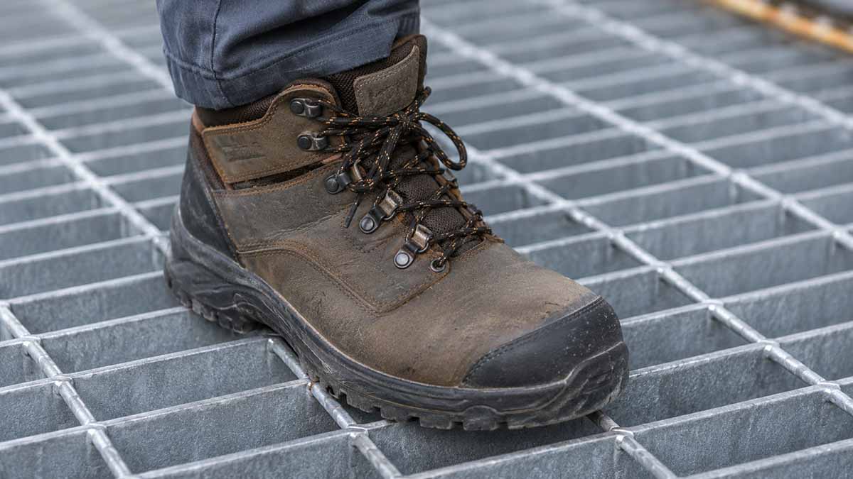 work boot on steel grating
