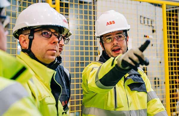 Engineers wearing hard hats in an industrial facility